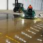 Industrial concrete polishing using a power trowel for large areas quickly