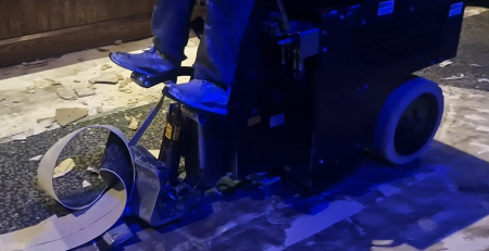 Using flooring tools to remove products like carpet.