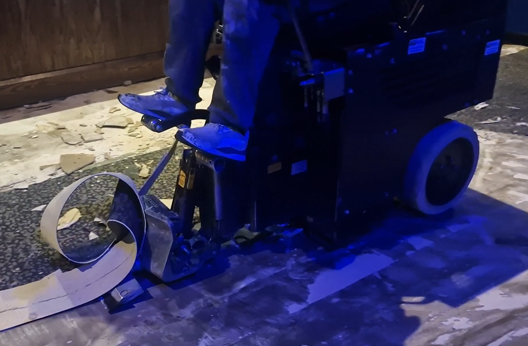 Using flooring tools to remove products like carpet.